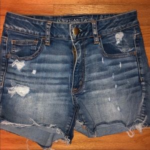 Mid-rise distressed denim shorts